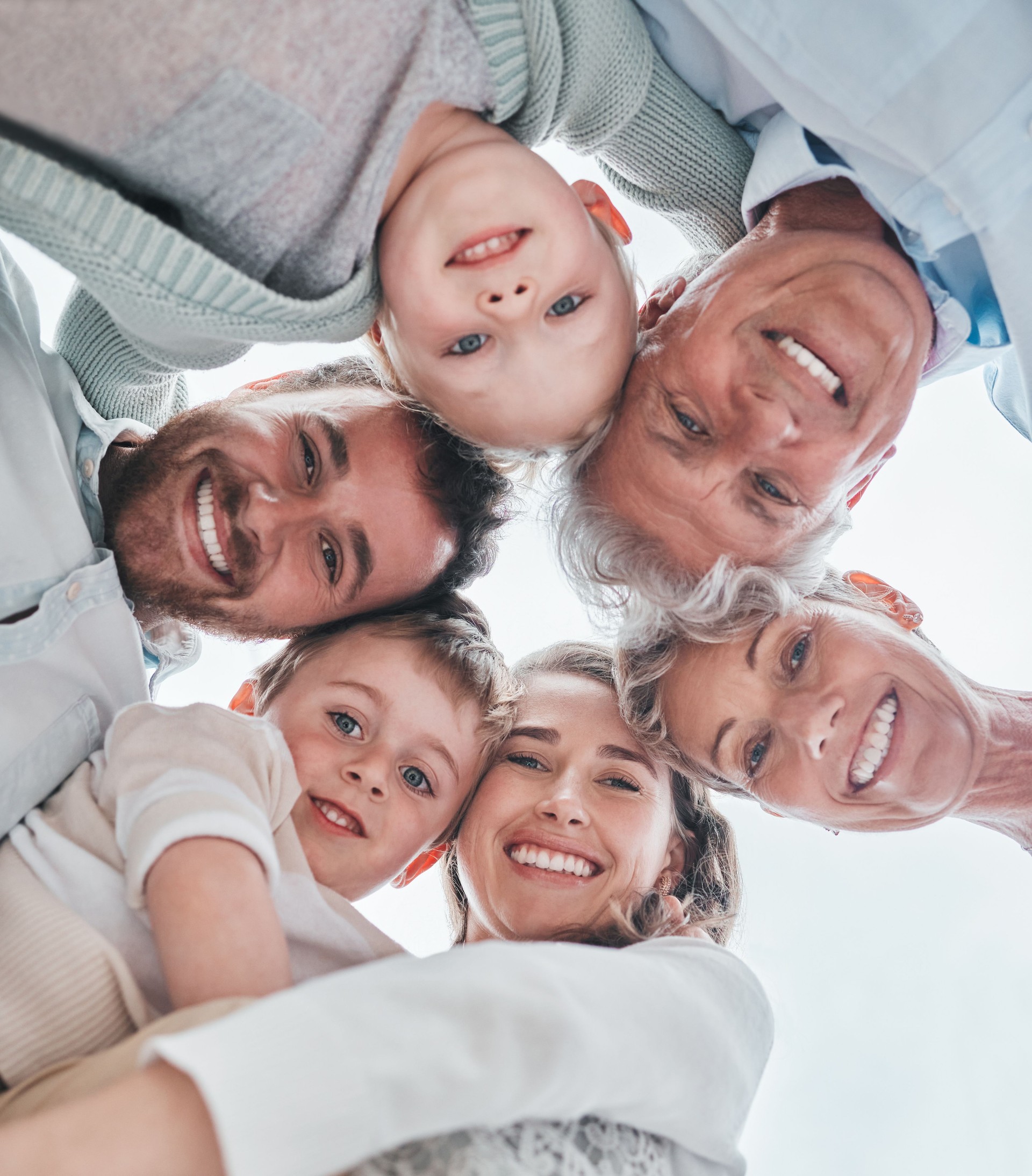 Low angle shot of a happy family huddled together